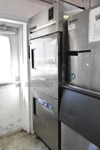 True TA1R-2HS commercial cooler, 2 half doors, on casters, 115V, 1-phase. Stainless exterior, visible wear.