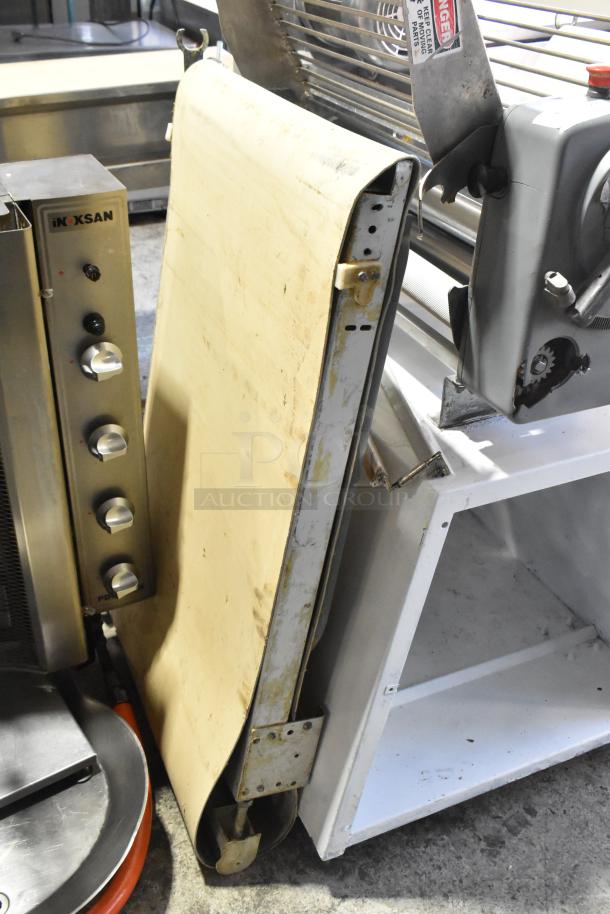 Rondo Seewer commercial reversible dough sheeter, floor model, 208/250 volts, 1 phase, sturdy metal construction, used condition.