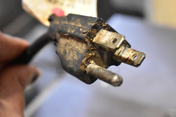 The image shows a close-up of a worn electrical plug from a 2019 Inoksan PDG500N countertop gyro machine.