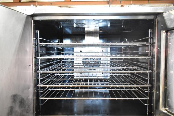 Royal RCOD-1 commercial convection oven, solid view-through door, thermostatic controls, natural gas powered, inside view showing racks.
