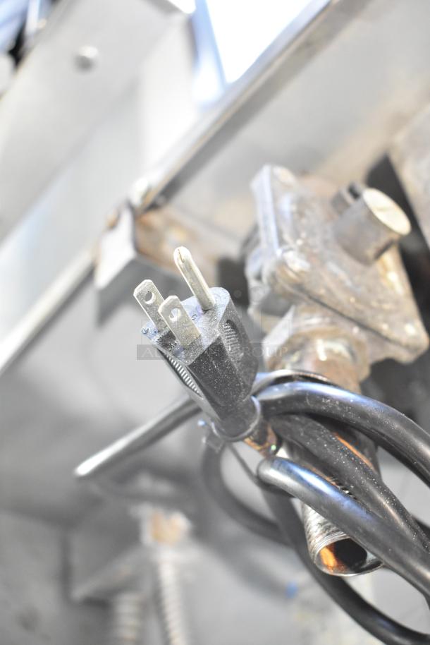 Close-up view of the Royal RCOD-1 convection oven's power plug and cable, highlighting the electrical connections.