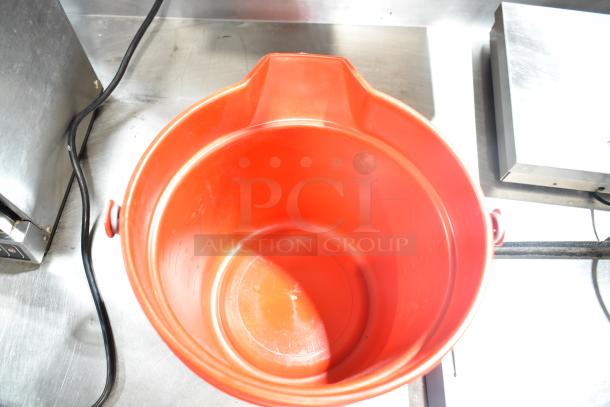 Two red poly buckets in good condition, round shape, sturdy handles, ideal for versatile use. Auction includes both buckets.