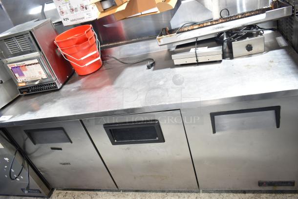 True TWT-72 Commercial 3 Door Work Top Cooler, 115 Volts, 1 Phase; Stainless steel, used condition, some surface wear.