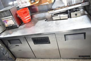 True TWT-72 Commercial 3 Door Work Top Cooler, 115 Volts, 1 Phase; Stainless steel, used condition, some surface wear.