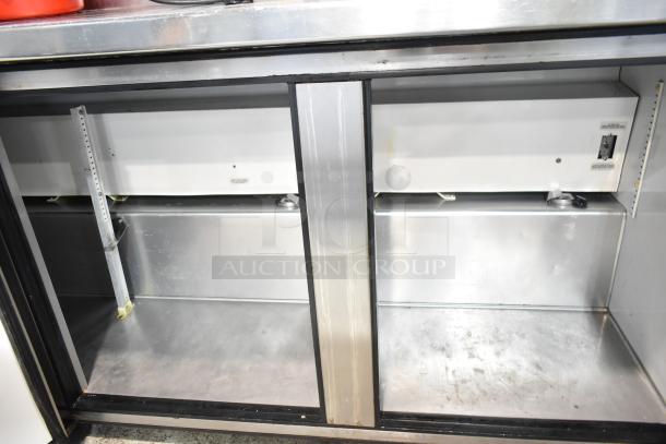 True TWT-72 Commercial 3 Door Work Top Cooler, stainless interior, visible shelving, operational condition, 115V.