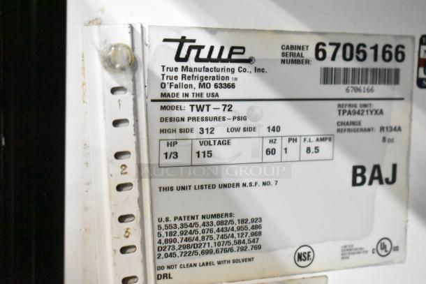 True TWT-72 commercial cooler label, model info: TWT-72, 115 volts, 1 phase, NSF listed, refrigerant R134A. Made in USA.
