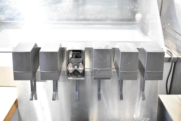 Commercial 6 flavor carbonated beverage machine, stainless steel, 115 volts, 1 phase, good condition, Lancer brand.