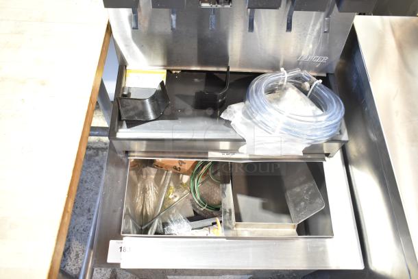 Commercial 6-Flavor Beverage Machine, 115V, 1 Phase. Includes accessories like tubing and trays, condition appears used.