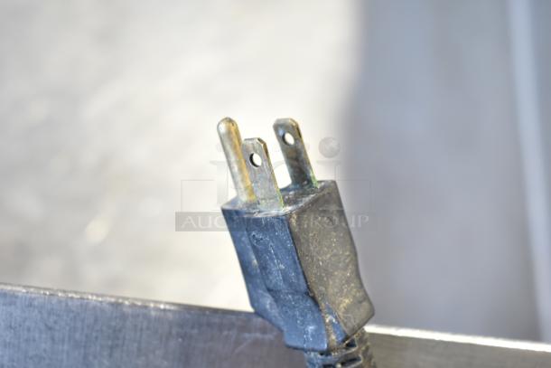 Cleveland commercial floor braising pan plug showing signs of wear, indicating prior use.