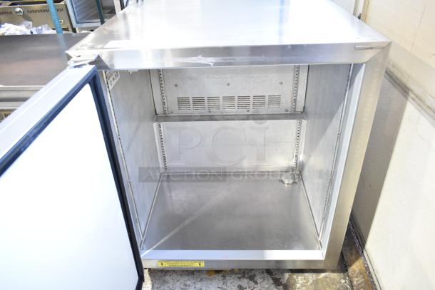 Silver King SKR27 commercial undercounter cooler, stainless steel, single door, open to show interior, good condition.