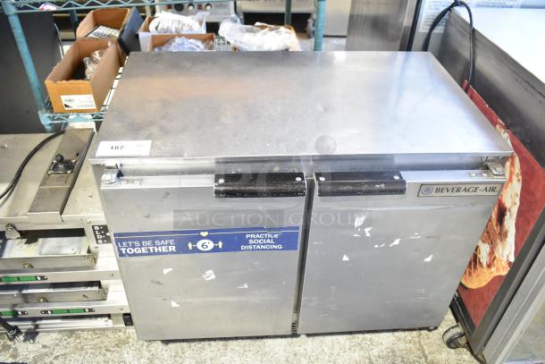 Beverage Air UCR34 commercial 2-door undercounter cooler, on casters, 115 volts, 1 phase, moderate wear, safety label visible.