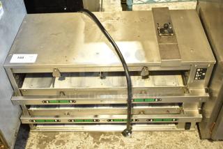 Commercial countertop dedicated holding bin in silver, featuring three adjustable shelves with temperature controls. Moderate wear visible.