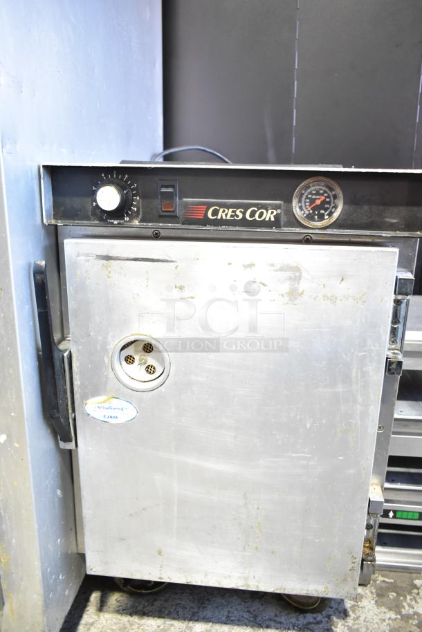 CresCor Commercial Heated Holding Cabinet with dial and gauge, on casters, 115V, 1 Phase, shows wear.