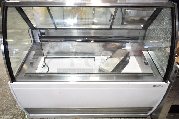 Commercial countertop merchandiser, 115 volts, 1 phase. Notable glass damage on the side. Brand: Marchia.