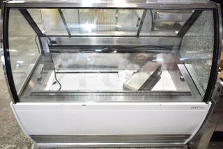 Commercial countertop merchandiser, 115 volts, 1 phase. Notable glass damage on the side. Brand: Marchia.