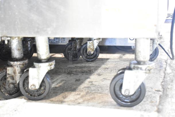 2023 Frymaster PH155CSE commercial fryer on casters, showing close-up of wheels. 50 lb capacity, natural gas, 80,000 BTU.