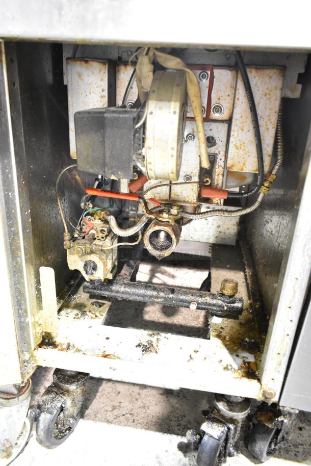 2023 Frymaster PH155CSE commercial gas fryer, 50 lb. capacity, on casters, 80,000 BTU, visible interior components, used condition.