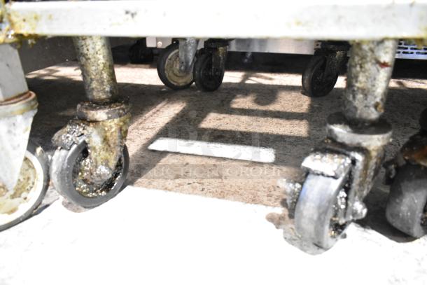 2023 Frymaster PH155CSE commercial fryer wheels. Natural gas, 50 lb capacity, 80,000 BTU, on casters, visible grease.