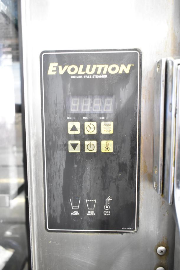 AccuTemp Evolution steam cabinet control panel, model P61201D06000200, featuring digital display and control buttons.