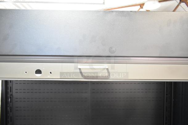 Federal Industries VRSS6078S vertical open air merchandiser top view, featuring sturdy metal handle, in good condition.