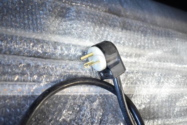 Federal Industries VRSS6078S merchandiser power plug on bubble wrap, showing 115V, 1-phase adapter.