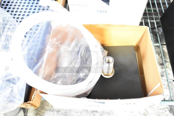 Brand new Regency 6" x 6" stainless steel black matte beer drip tray with rinser, model 600MBD6R, in original packaging.