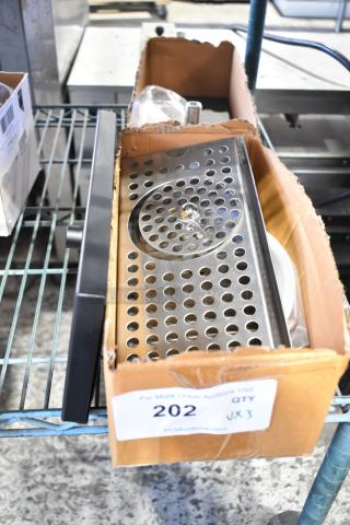 3 new Regency C1621 12" x 5" stainless steel beer drip trays with rinser, in original packaging.