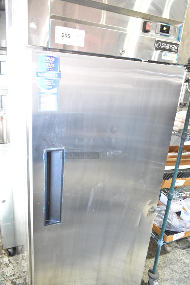 Dukers D28AF commercial single door reach-in freezer on casters, stainless steel, 115V, 1 phase. Warranty sticker visible.