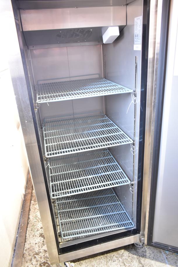 Dukers D28AF commercial single door reach-in freezer with adjustable wire shelves, stainless steel finish, on casters, 115V.