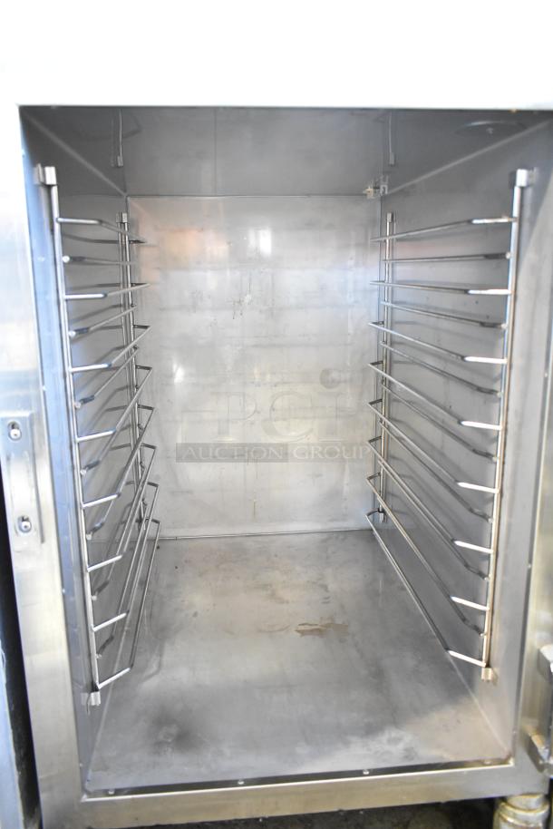 Alto Shaam Halo Heat heated holding cabinet with interior racks and commercial casters, stainless steel, in good condition.