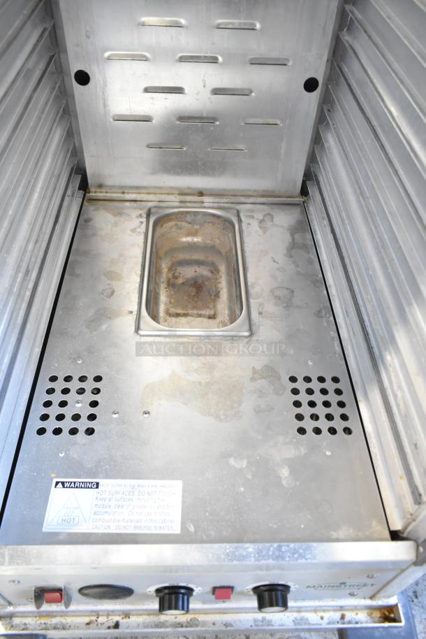 Mainstreet Commercial Heated Holding Cabinet with temperature dials, warning label, on casters. 115 Volts, 1 Phase.