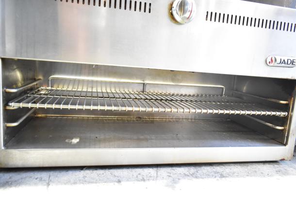 Jade JGM-36 Commercial Gas Cheese Melter in stainless steel. Features a wire rack, visible temperature control, and branded logo.