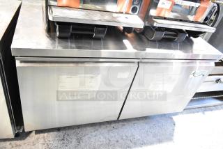 Avantco 2 Door Undercounter Cooler, stainless steel, on commercial casters. 115 volts, 1 phase. Visible Avantco logo.