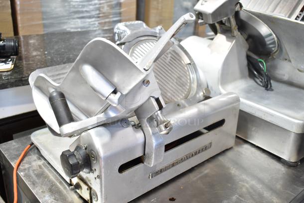 Globe commercial automatic meat slicer with blade sharpener, 115 volts, 1 phase, in used condition, visible manufacturer label.