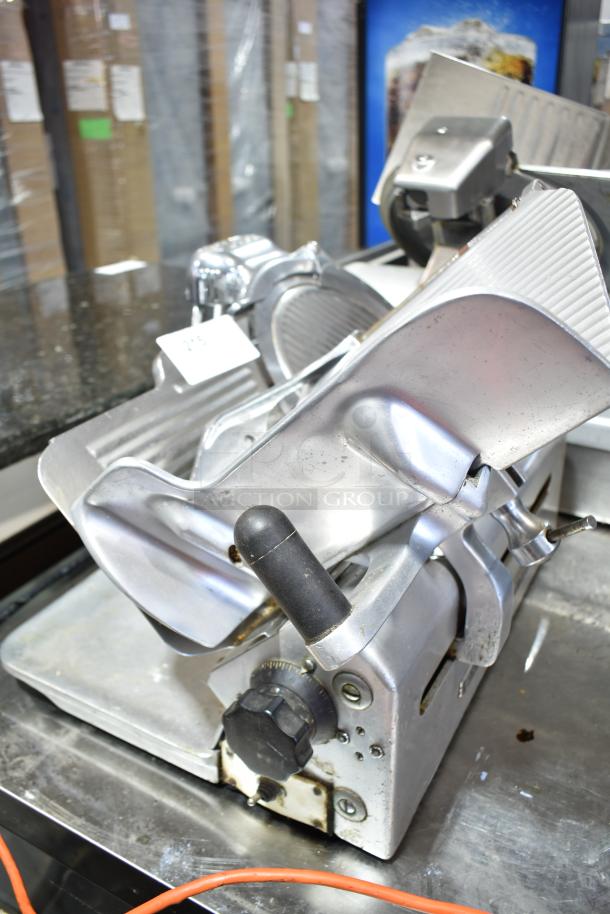 Globe Commercial Countertop Automatic Meat Slicer with blade sharpener, 115 Volts, 1 Phase, metal body, used condition.