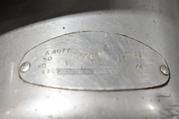 Globe Commercial Countertop Automatic Meat Slicer with Blade Sharpener, 115V, 1 Phase, Model A 4077, shown with metal label plate.