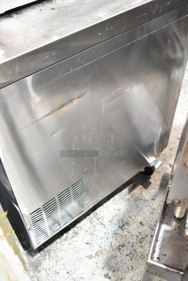 Avantco 178AU60R commercial 2-door undercounter cooler with casters. Stainless steel, visible wear, 115 volts, 1 phase.