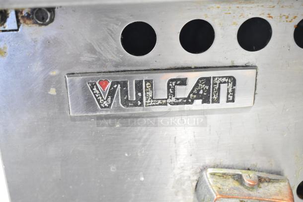 Vulcan Commercial Countertop Gas Charbroiler Grill, metal finish, showing brand logo. Features equipment stand with casters.