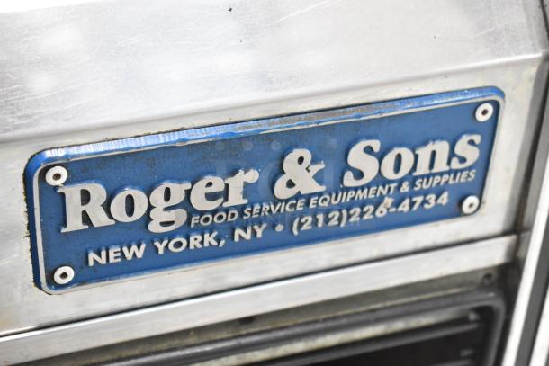 Marc Commercial deli display case, 115V, 1 Phase, metal exterior with "Roger & Sons" label, New York. Slight wear visible.