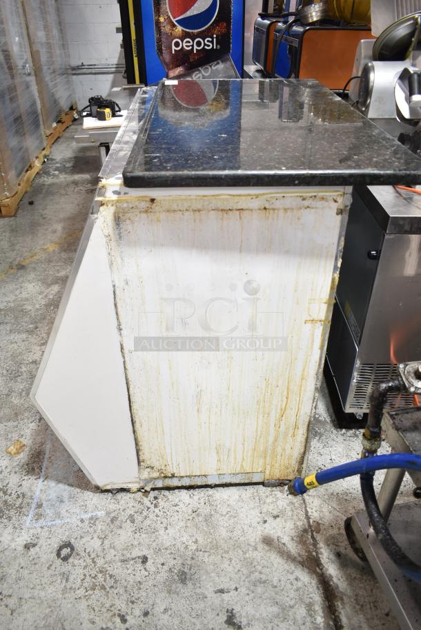 Marc commercial floor-style deli display case with visible wear and stains on the exterior. 115 volts, 1 phase.