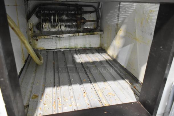 Marc Commercial Deli Display Case interior showing used condition, visible grime on surfaces, refrigeration coil, 115V, 1 Phase.