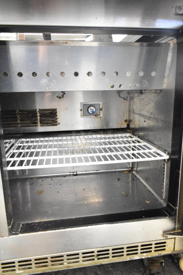 Everest EPBR2 commercial prep table interior view, missing back of mega top, on casters, 115 volts, 1 phase, used condition.