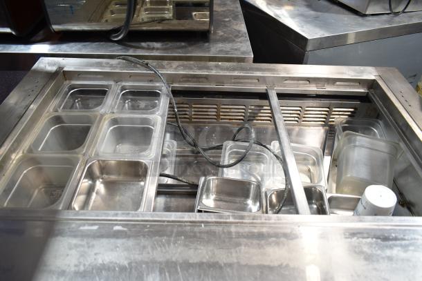 Everest EPBR2 sandwich prep table with missing mega top, stainless steel pans. 115V, 1 phase, on commercial casters.