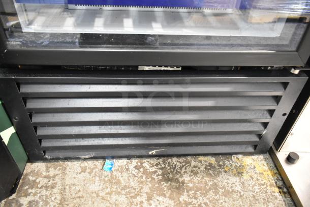 QBD CD26-HC commercial single door cooler merchandiser, black exterior, 115 volts, 1 phase, vent detail shown.