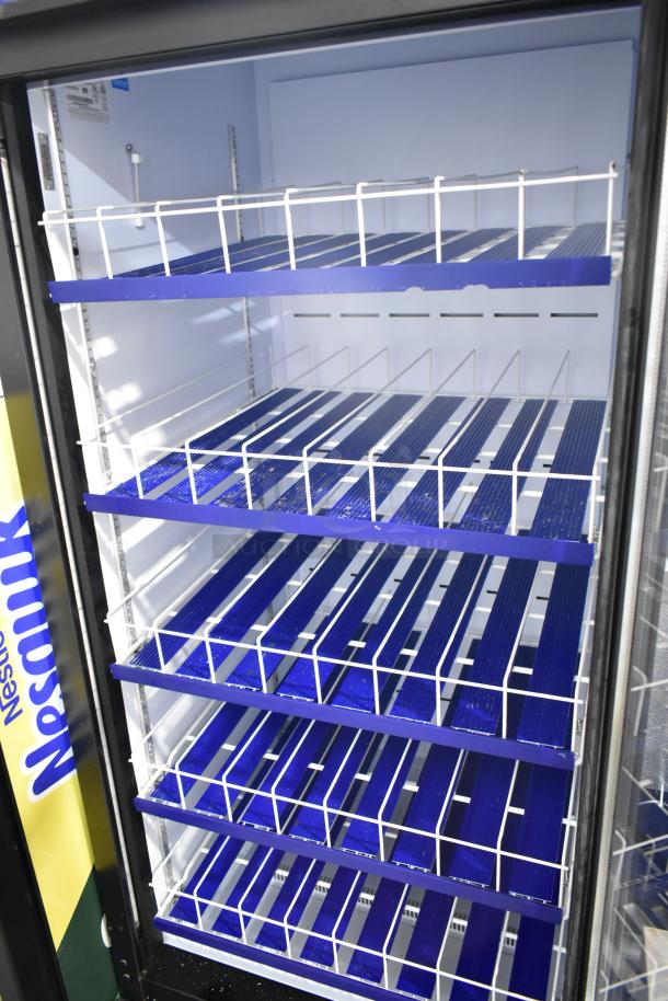 QBD CD26-HC commercial single door reach-in cooler, blue shelving, clean interior, 115V, 1 phase, branding: Nesquik.
