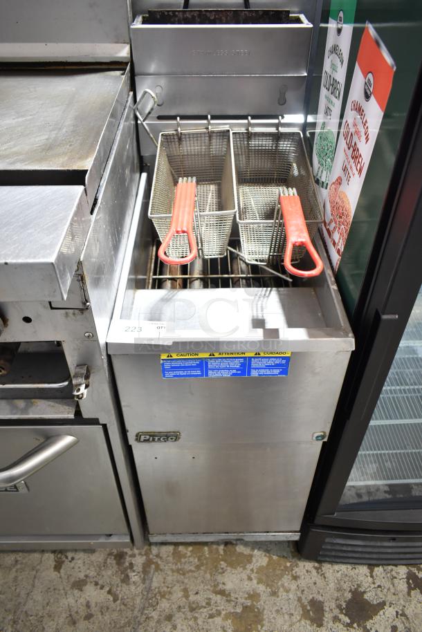 Pitco Frialator commercial gas fryer, stainless steel, with two baskets, red handles, visible caution labels, floor model.