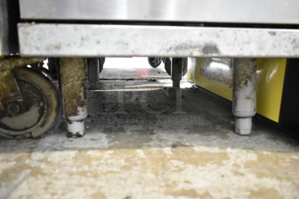 Pitco Frialator commercial floor gas fryer, stainless steel, visible on wheels, used condition, ideal for high-volume frying.