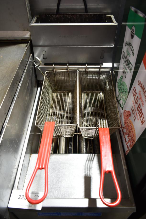 Pitco Frialator commercial gas fryer with dual baskets, stainless steel finish, red handles, in used condition. Model tags visible.