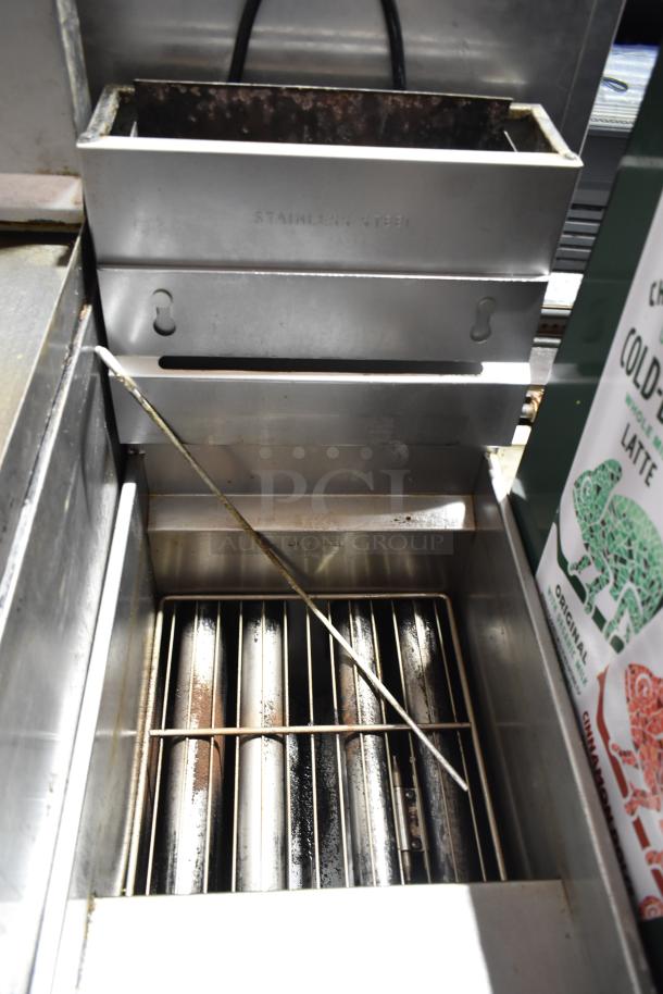 Pitco Frialator commercial gas deep fat fryer, floor style, stainless steel, showing interior and heating elements, used condition.