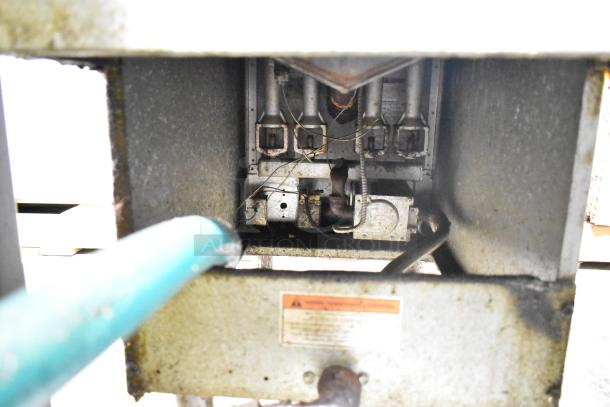 Pitco Frialator commercial gas deep fat fryer, interior view showing heating components and gas connections, used condition.